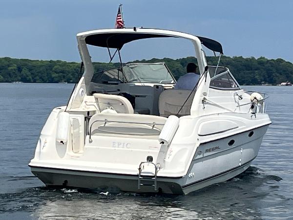 Slide: The Image of 1998 Regal 2760 boat cruising on a calm lake. - 2