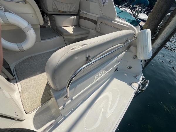 Slide: The Image of 1998 Regal 2760 boat interior with seating and water view. - 5