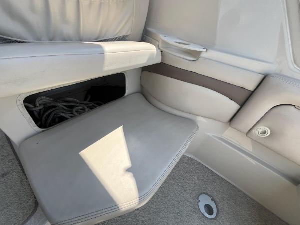 Slide: The Image of Interior seating of 1998 Regal 2760 boat with storage compartment. - 7