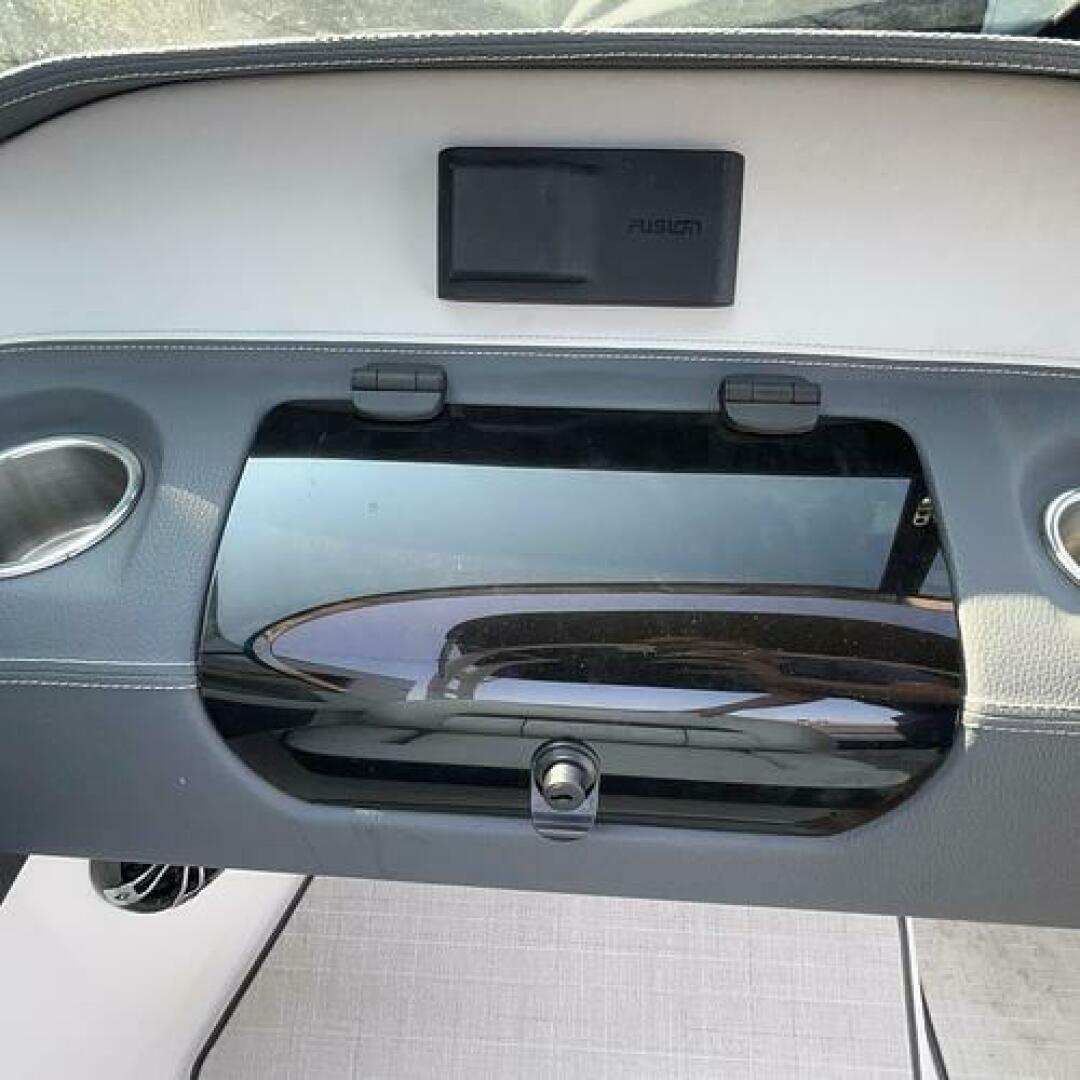 Slide: The Image of Glove Compartment Storage Compartment in front of the companion seat in this 2021 Regal LS4 for sale by Lucas Sochacki at Parma Marine (440) 915-8995 - 5184947