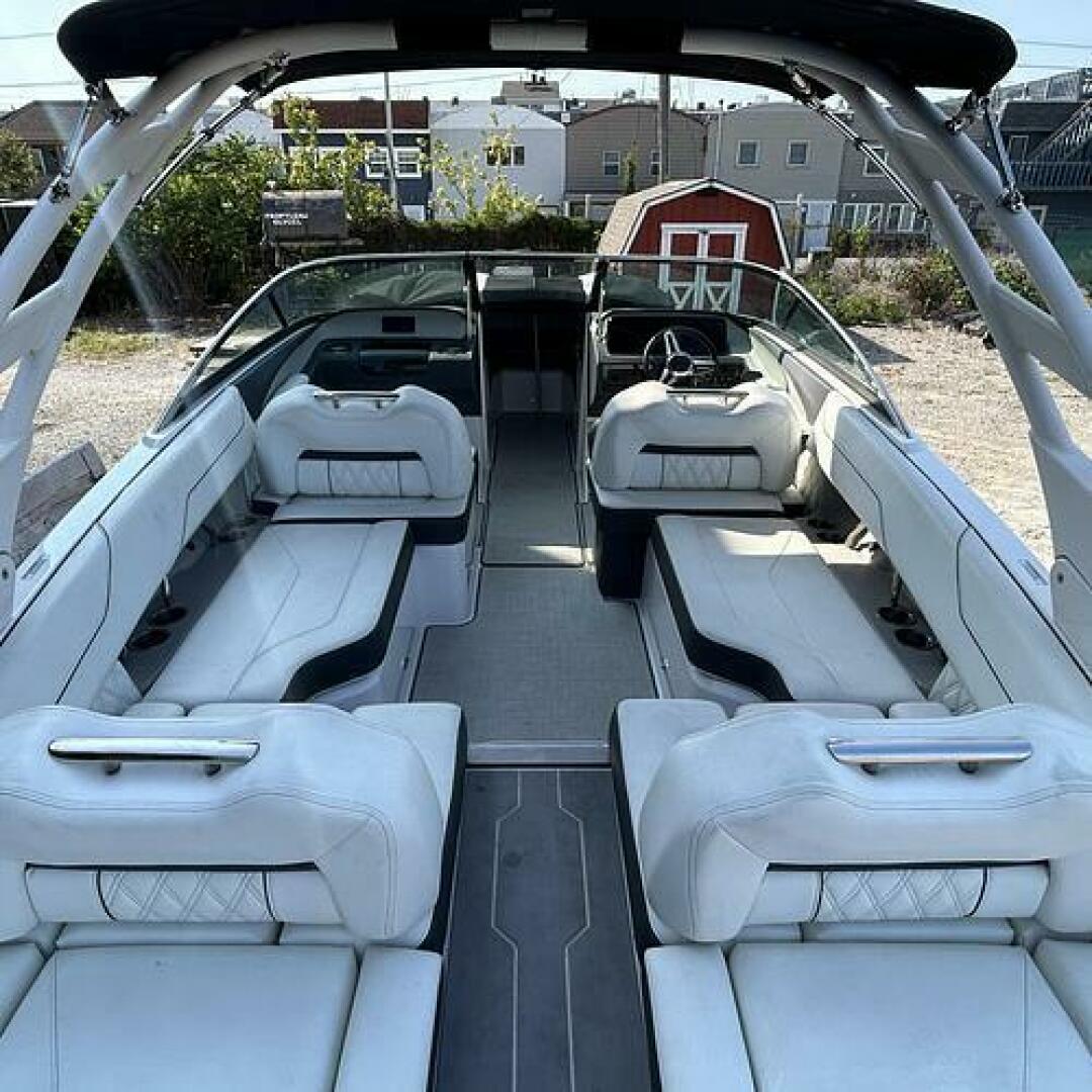Slide: The Image of Cockpit Cockpit with snap-in carpeting and white vinyl Upolstery on this 2021 Regal LS4 for sale by Lucas Sochacki at Parma Marine (440) 915-8995 - 5184937