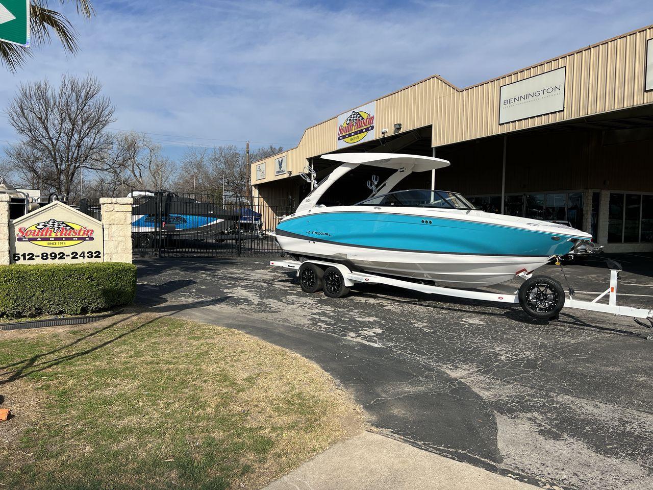 Slide: The Image of 2023 Regal LS6 Surf boat on trailer at South Austin Marine dealership. - 0