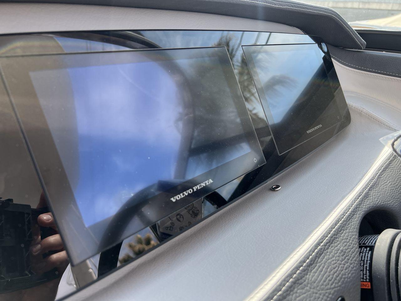 Slide: The Image of 2023 Regal LS6 Surf dashboard with dual Volvo Penta displays. - 15