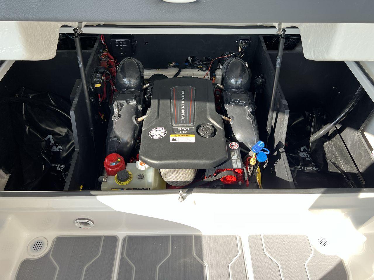 Slide: The Image of 2023 Regal LS6 Surf boat engine compartment with Volvo Penta engine. - 17