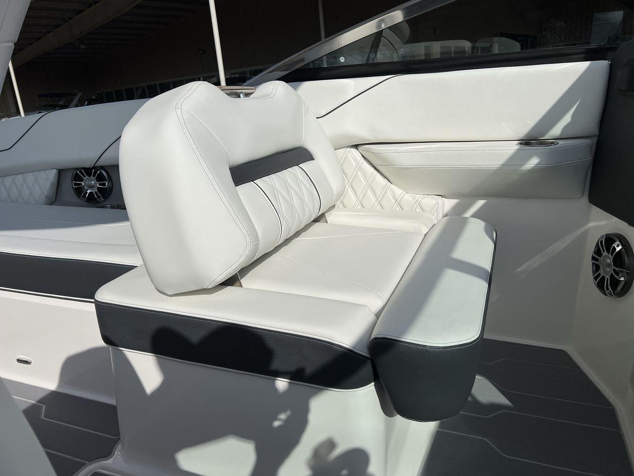 Slide: The Image of 2023 Regal LS6 Surf boat interior with white and black seating. - 20