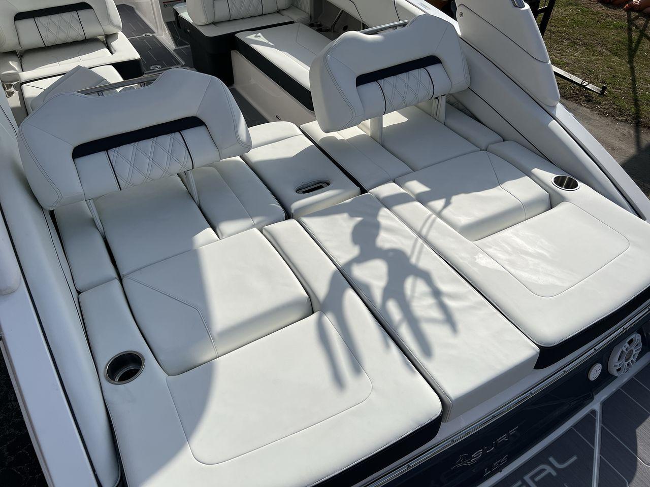 Slide: The Image of 2023 Regal LS6 Surf boat with luxurious white leather seating. - 24