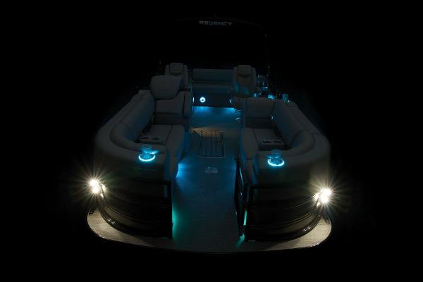 Slide: The Image of 2024 Regency 230 LE3 Sport pontoon boat with illuminated interior and exterior lights. - 48