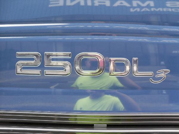 Slide: The Image of 2024 Regency 250 DL3 emblem on blue surface, reflecting surroundings. - 11