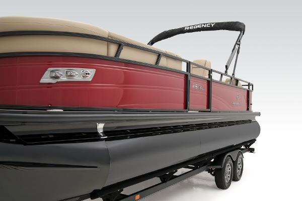 Slide: The Image of 2024 Regency 250 DL3 pontoon boat with red exterior and black trailer. - 19