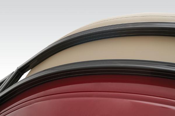 Slide: The Image of Close-up of 2024 Regency 250 DL3 boat exterior with red and beige detailing. - 20