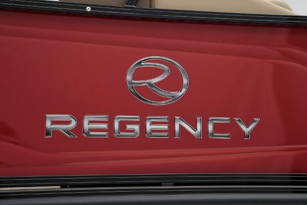 Slide: The Image of 2024 Regency 250 DL3 logo on red exterior. - 21