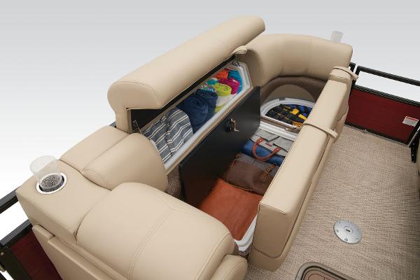Slide: The Image of 2024 Regency 250 DL3 boat with open storage compartment and beige seating. - 25