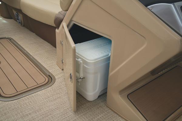 Slide: The Image of 2024 Regency 250 DL3 boat interior with built-in storage compartment and cooler. - 31