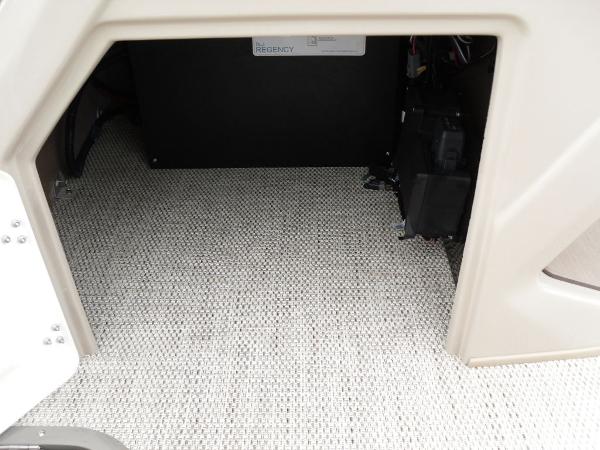 Slide: The Image of 2024 Regency 250 DL3 interior storage compartment with textured flooring. - 33