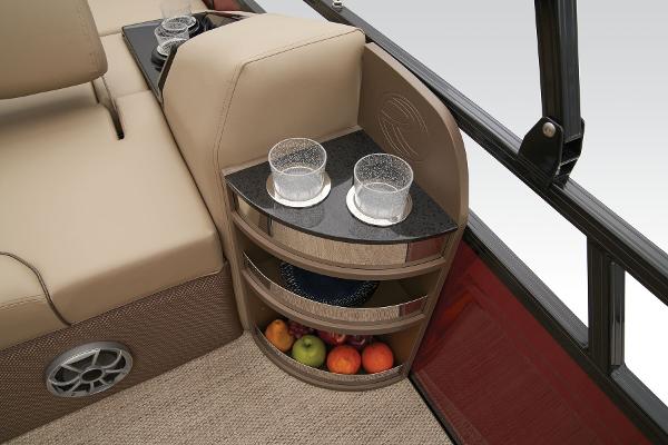 Slide: The Image of 2024 Regency 250 DL3 boat interior with cup holders and fruit storage. - 37
