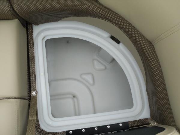 Slide: The Image of 2024 Regency 250 DL3 boat storage compartment with cushioned seating. - 38