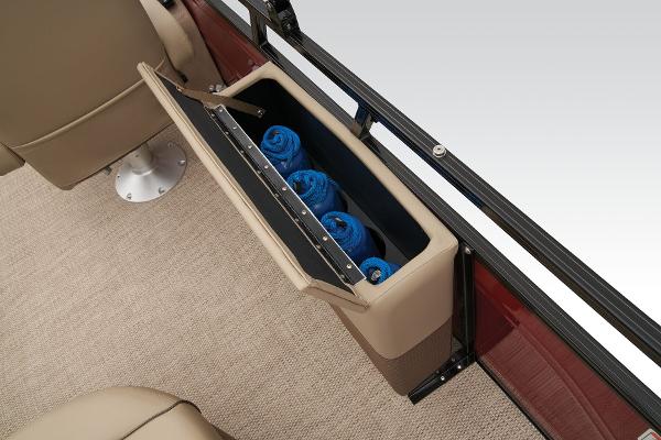 Slide: The Image of 2024 Regency 250 DL3 storage compartment with blue towels. - 38