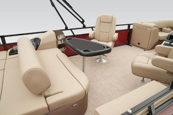 Slide: The Image of 2024 Regency 250 DL3 boat interior with beige seating and a central table. - 42