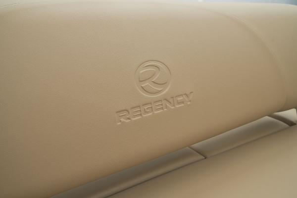 Slide: The Image of 2024 Regency 250 DL3 beige leather seat with embossed logo. - 44