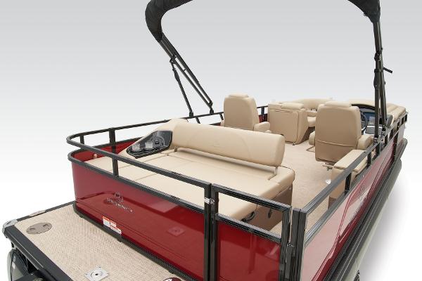 Slide: The Image of 2024 Regency 250 DL3 pontoon boat with beige seating and red exterior. - 45