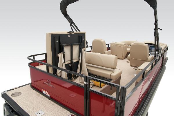 Slide: The Image of 2024 Regency 250 DL3 pontoon boat with beige seating and red exterior. - 46