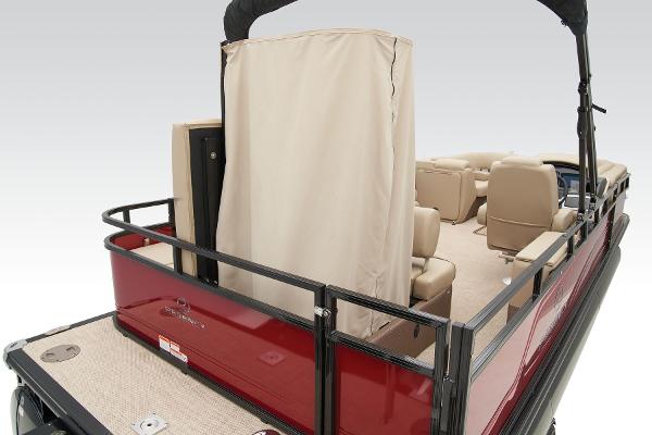 Slide: The Image of 2024 Regency 250 DL3 pontoon boat with beige interior and privacy curtain. - 47