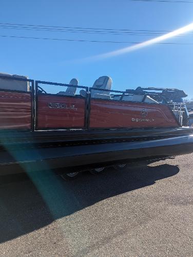Slide: The Image of 2024 Regency 250 LE3 Sport pontoon boat in sunlight, side view. - 1