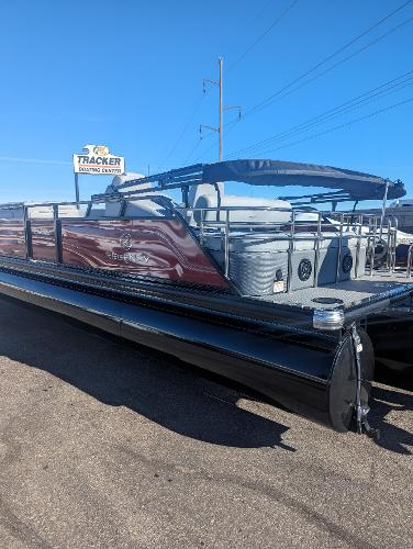 Slide: The Image of 2024 Regency 250 LE3 Sport pontoon boat at Tracker dealership. - 2