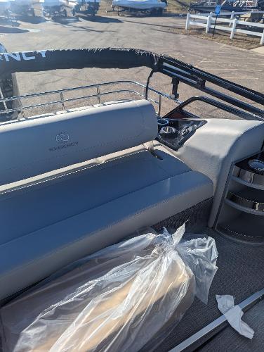 Slide: The Image of 2024 Regency 250 LE3 Sport boat interior with seating and cup holders. - 8