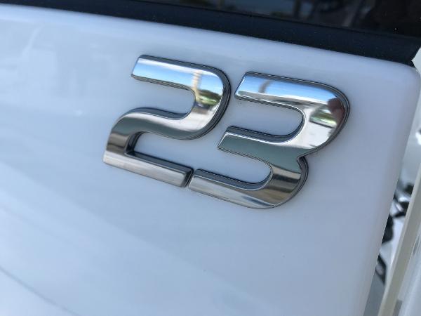 Slide: The Image of Chrome "23" emblem on a 2023 Regulator boat. - 16