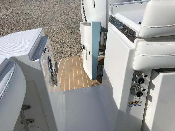 Slide: The Image of 2023 Regulator 23 boat interior with seating and storage compartments. - 19