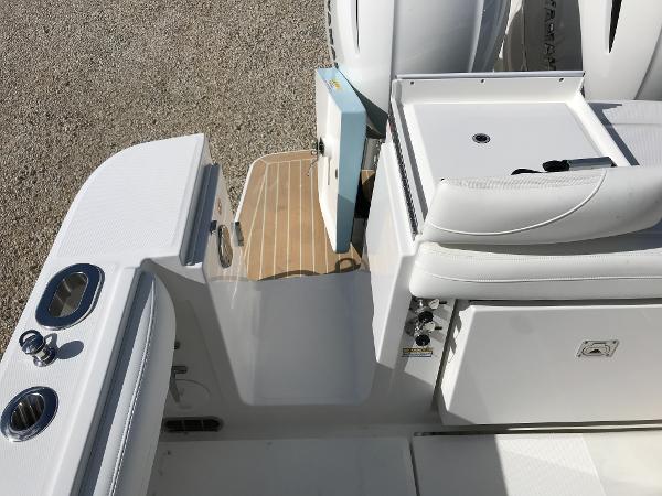 Slide: The Image of 2023 Regulator 23 boat interior with white seating and deck details. - 22