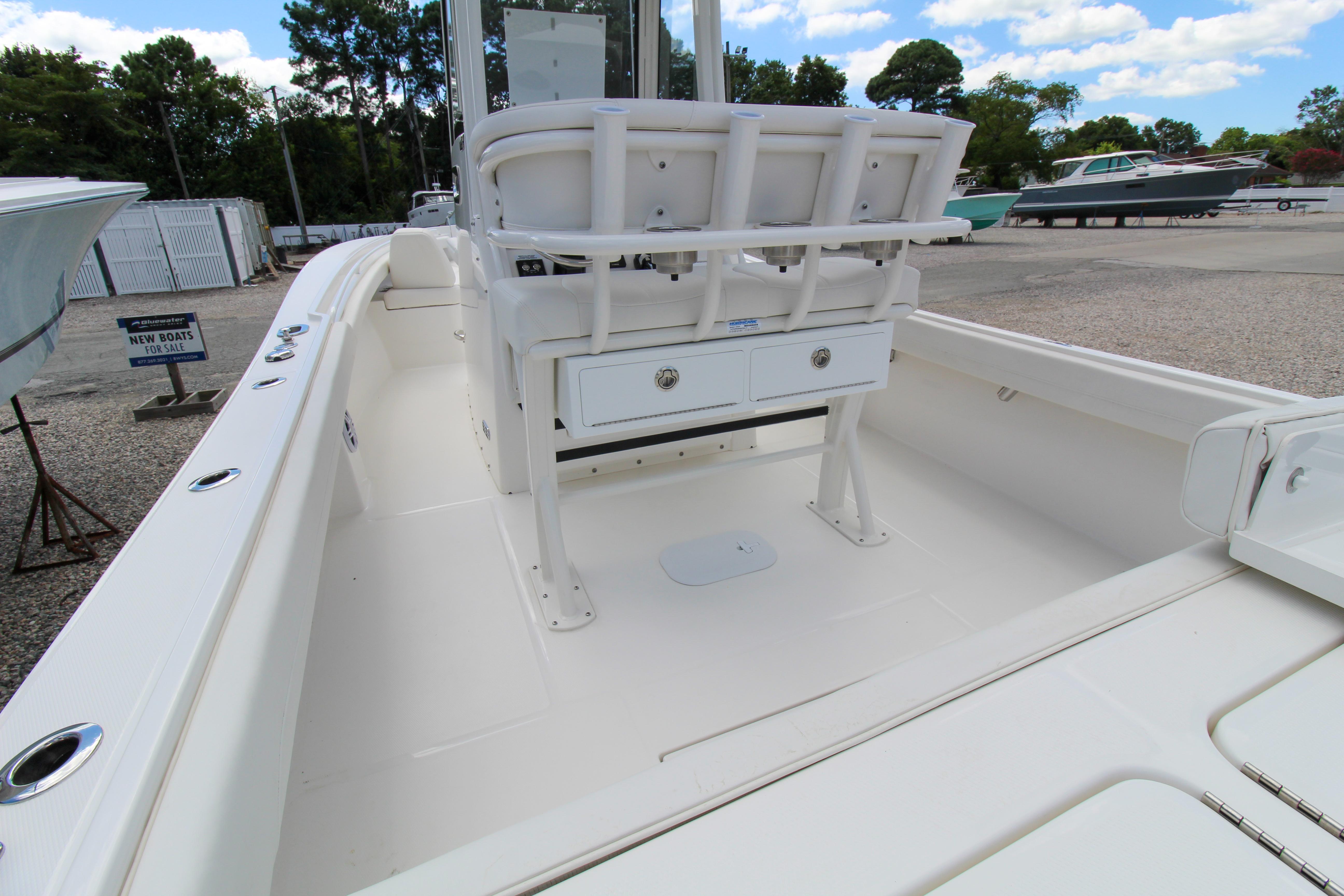 Slide: The Image of 2024 Regulator 23 boat interior with seating and storage compartments. - 7