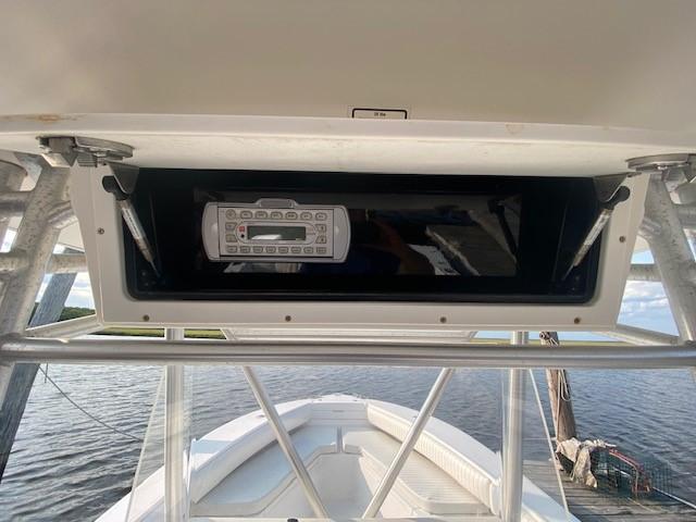 Slide: The Image of 2005 Regulator 23 Center Console boat with overhead console and water view. - 10