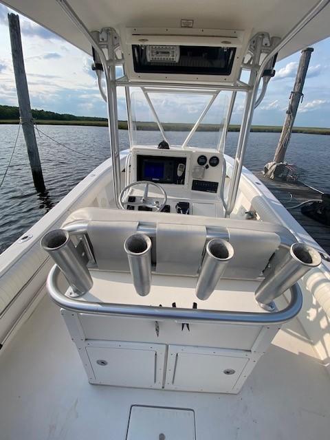 Slide: The Image of 2005 Regulator 23 Center Console boat interior with rod holders and navigation equipment. - 12