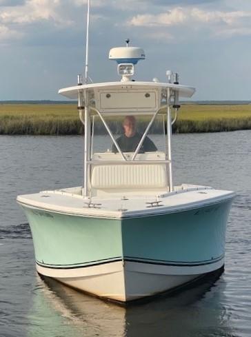 Slide: The Image of 2005 Regulator 23 Center Console boat on calm water, front view. - 3