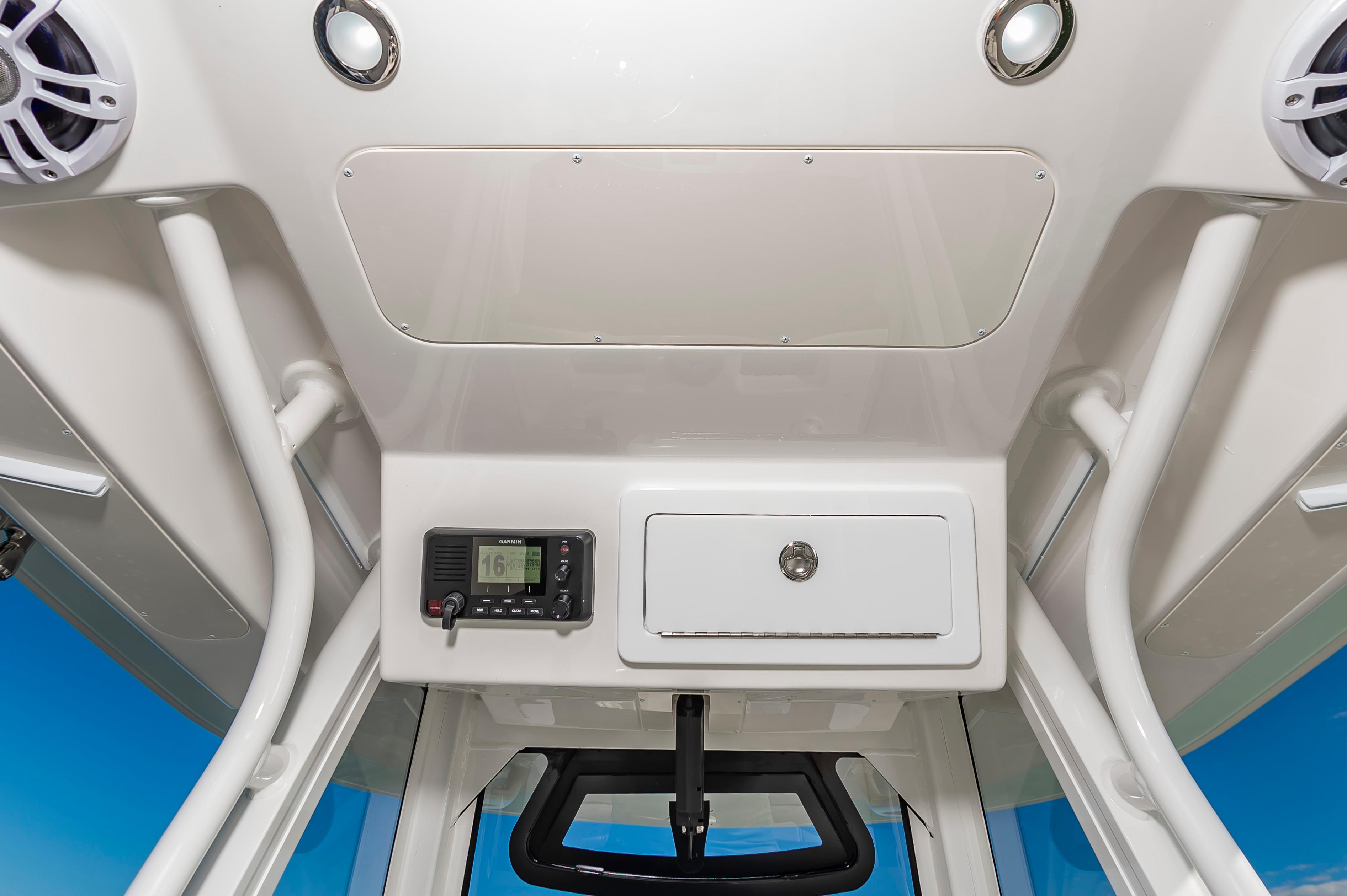 Slide: The Image of 2024 Regulator 28 boat console with Garmin device and storage compartment. - 12