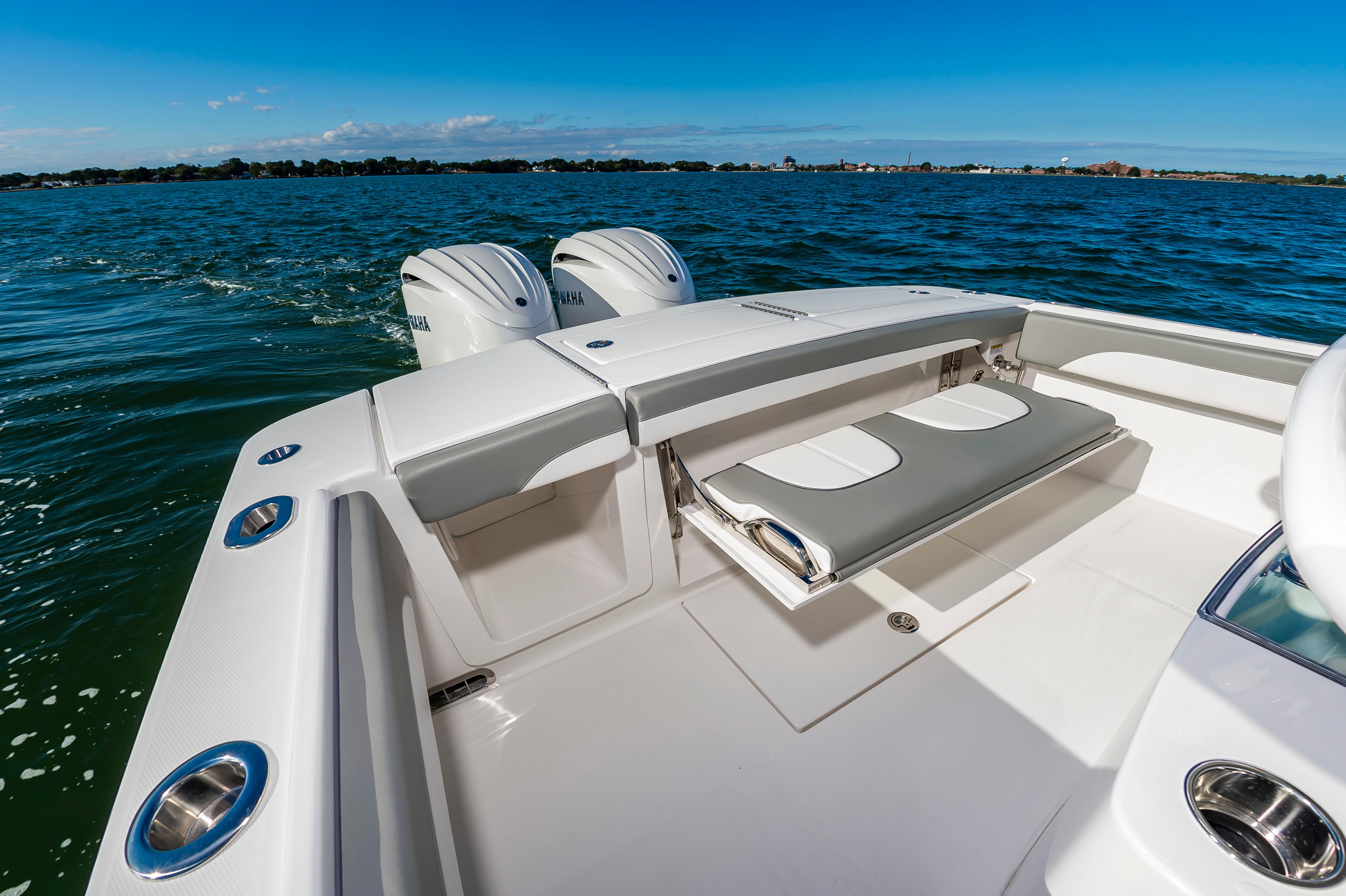 Slide: The Image of 2024 Regulator 28 boat with dual Yamaha engines on open water. - 17
