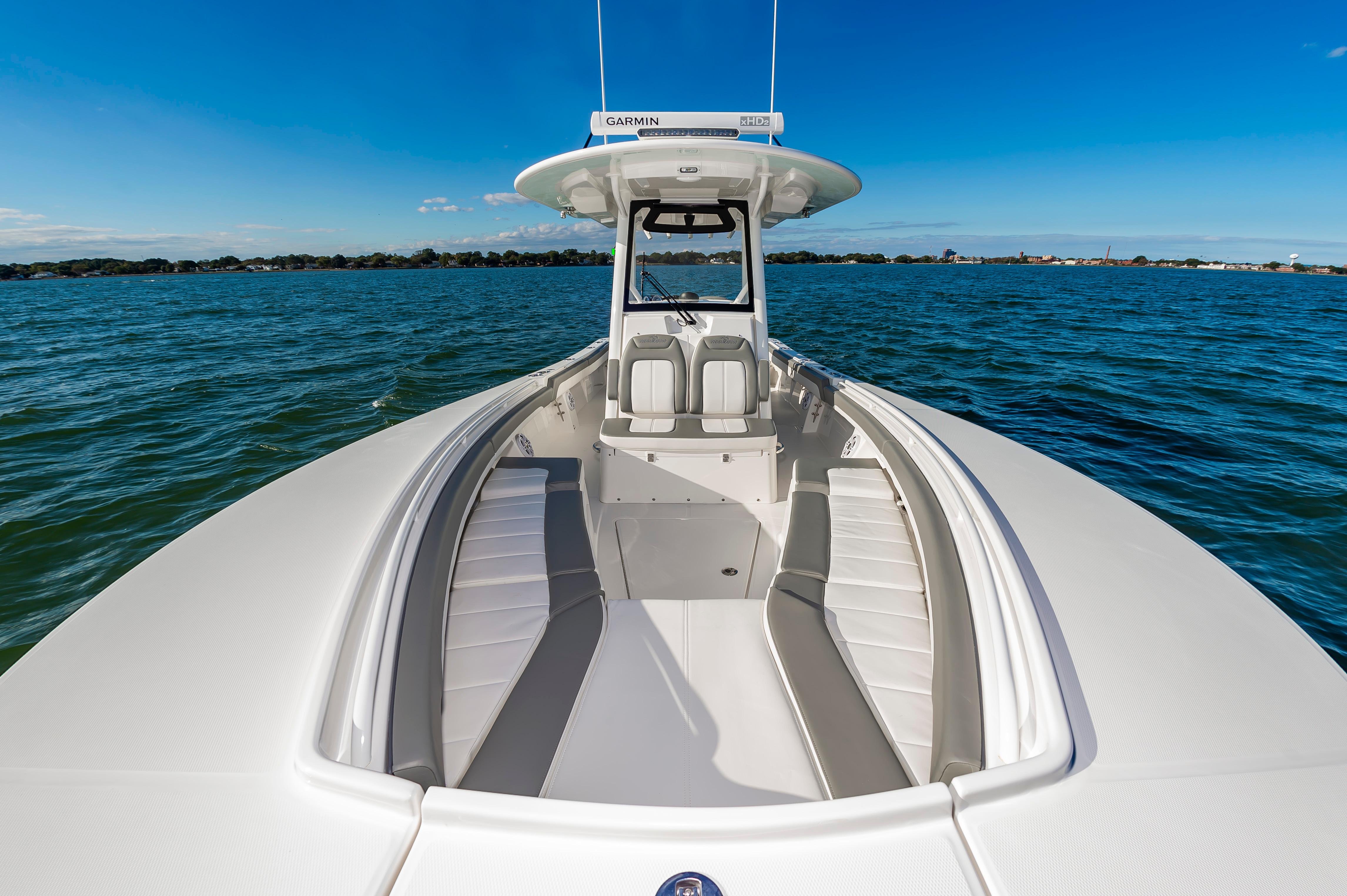 Slide: The Image of 2024 Regulator 28 boat on open water with spacious seating. - 20