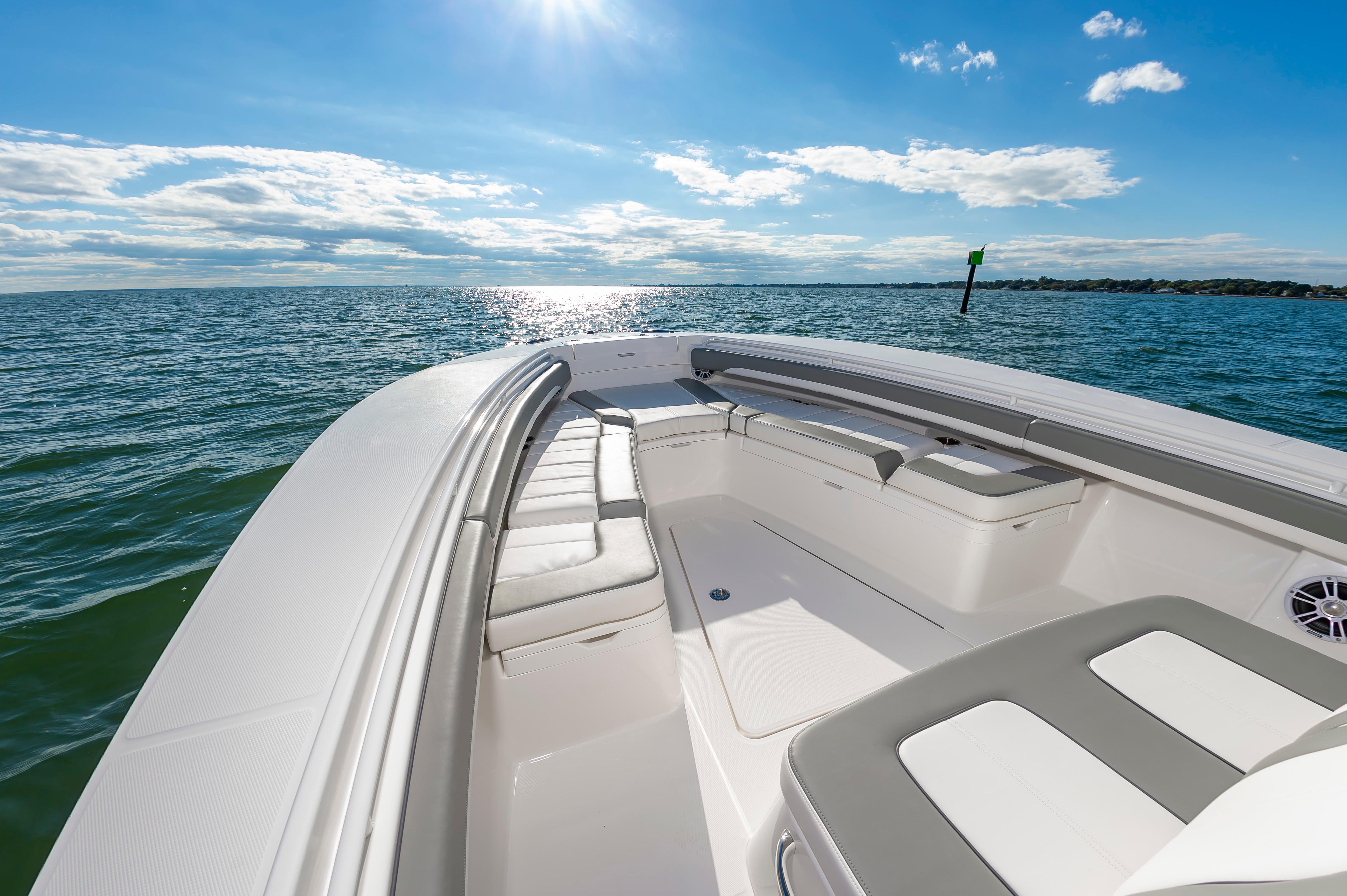 Slide: The Image of 2024 Regulator 28 boat interior with cushioned seating on open water. - 22