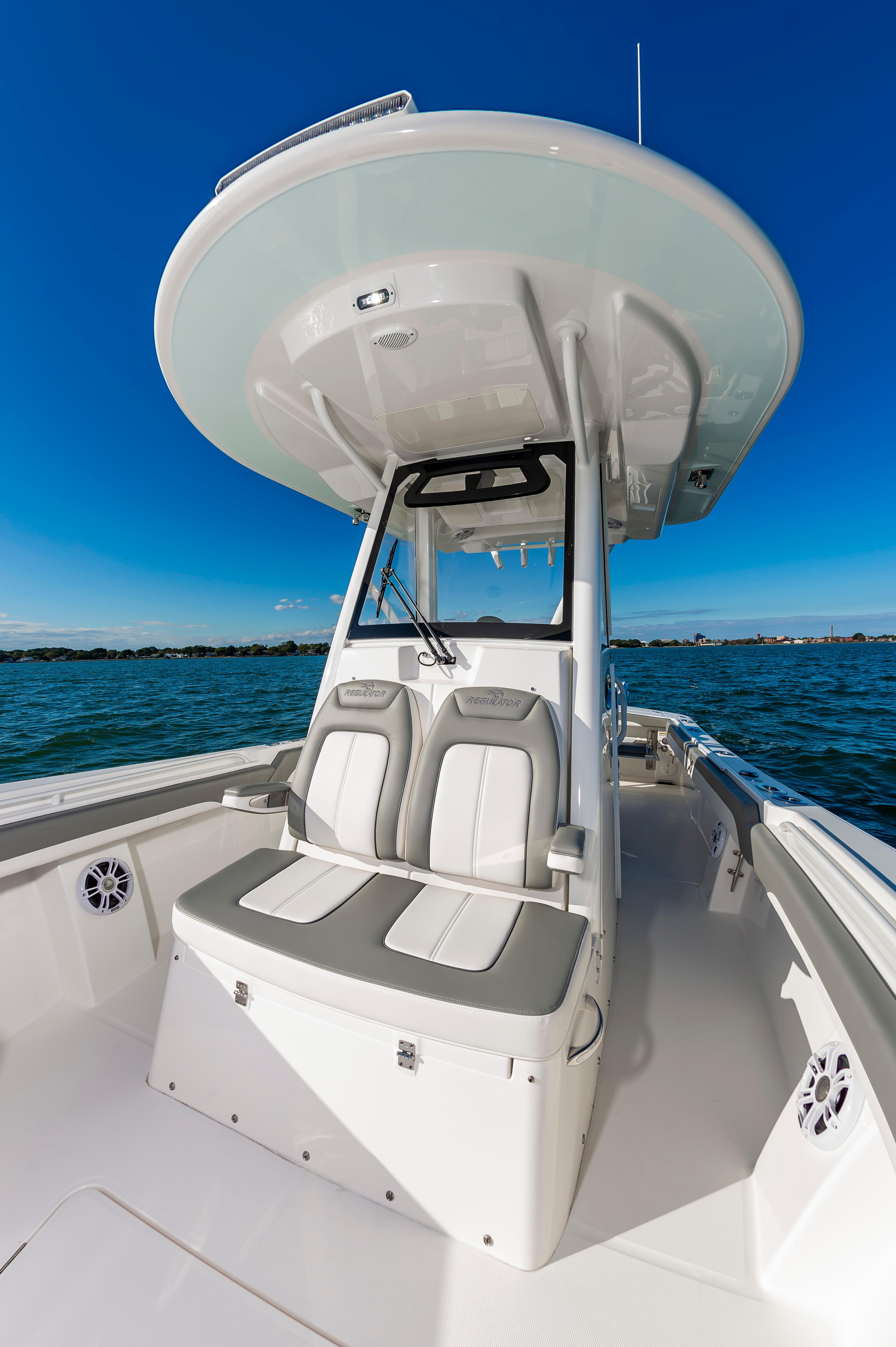 Slide: The Image of 2024 Regulator 28 boat interior with dual seats and ocean view. - 24