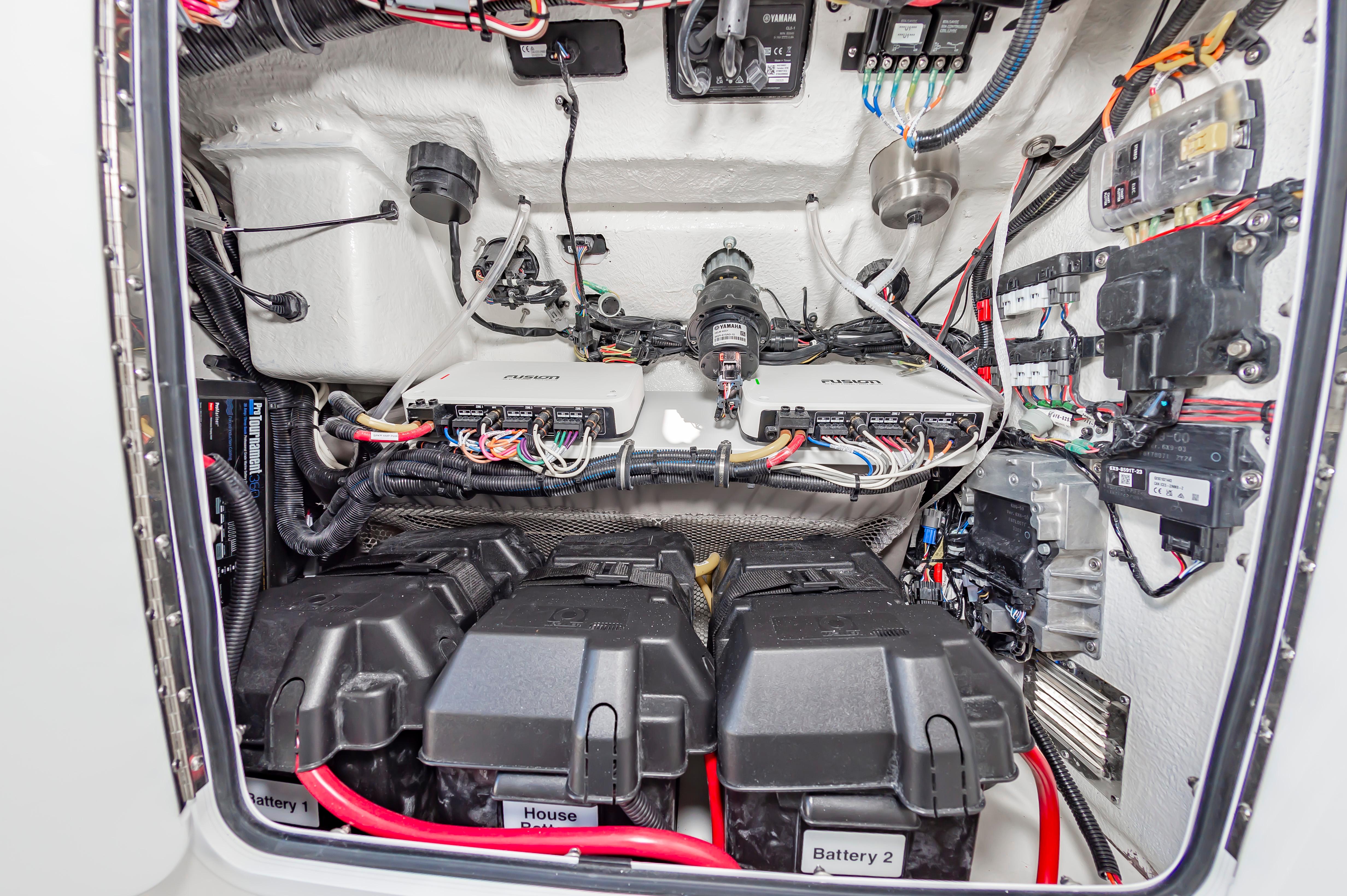 Slide: The Image of 2024 Regulator 28 boat electrical system with batteries and wiring. - 28