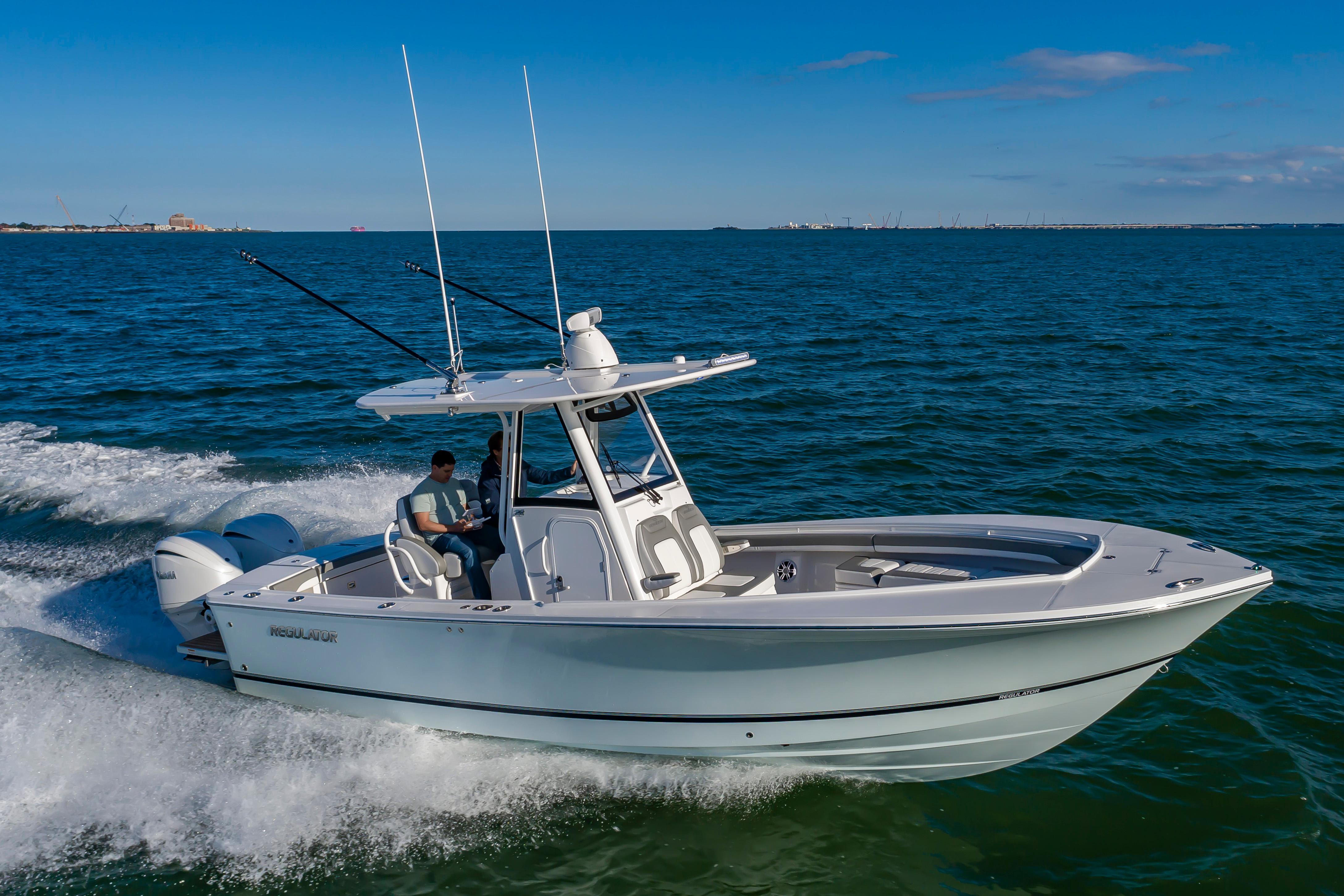 Slide: The Image of 2024 Regulator 28 boat cruising on open water. - 3