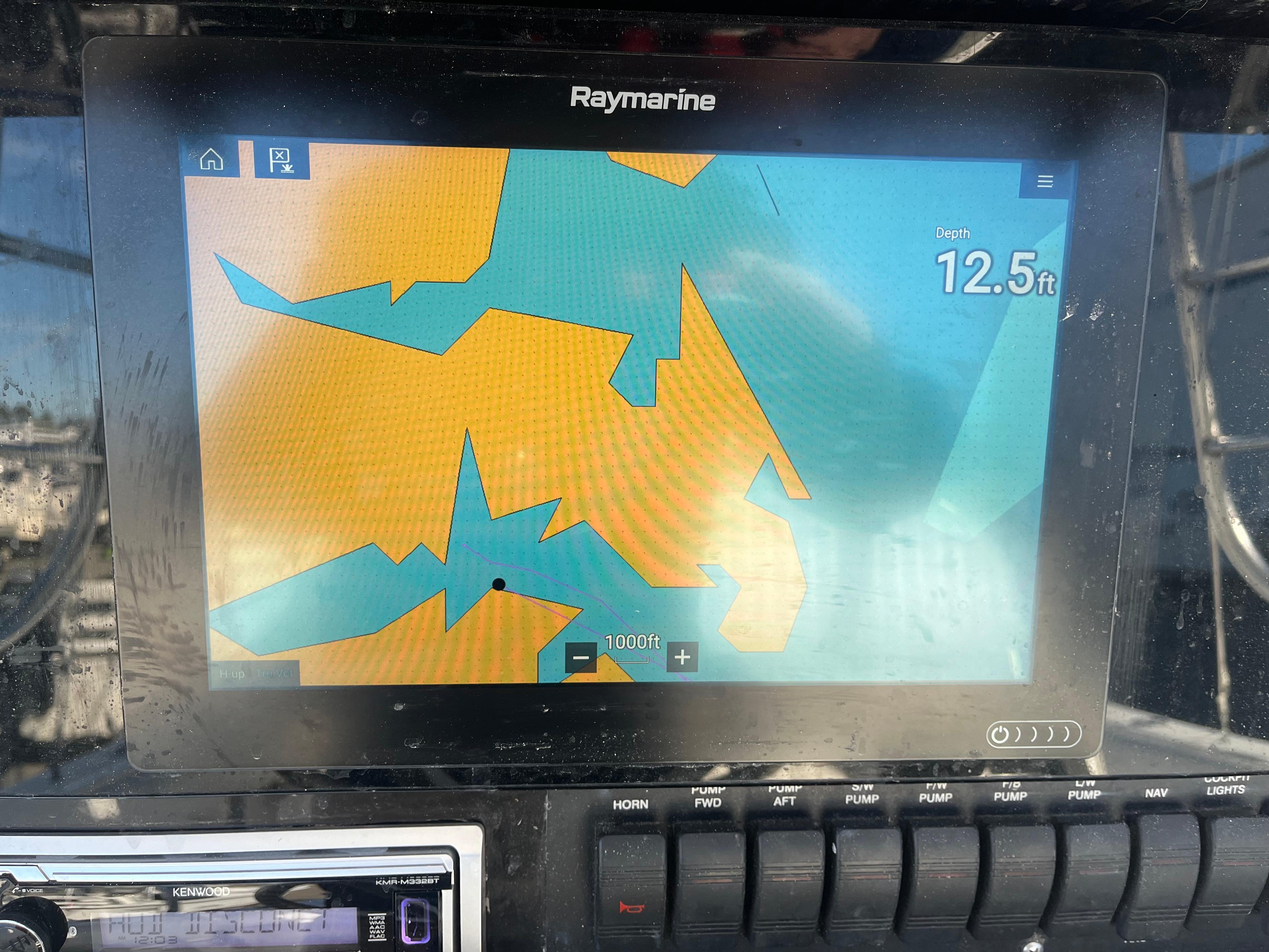 Slide: The Image of Raymarine navigation display on 2000 Regulator 32 Center Console, showing depth of 12.5 feet. - 14