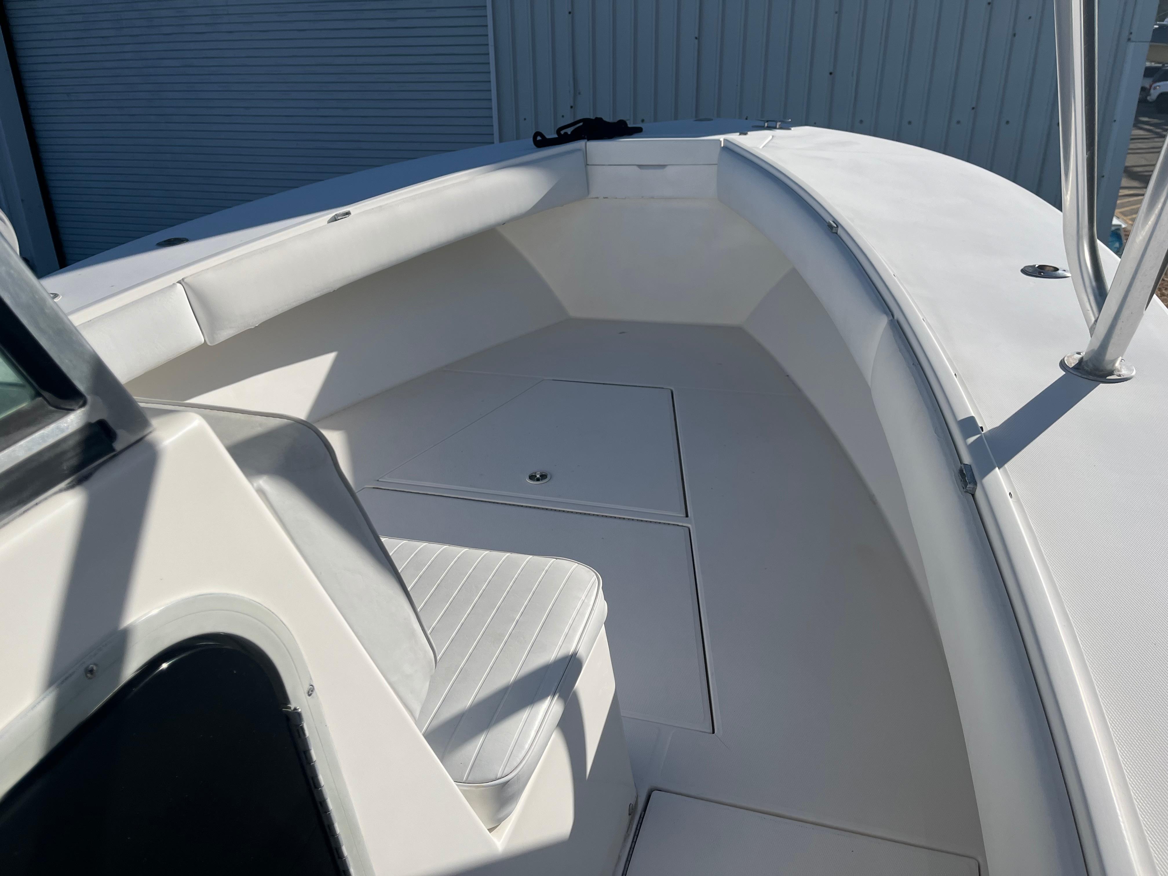 Slide: The Image of 2000 Regulator 32 Center Console boat interior with seating and storage compartments. - 17
