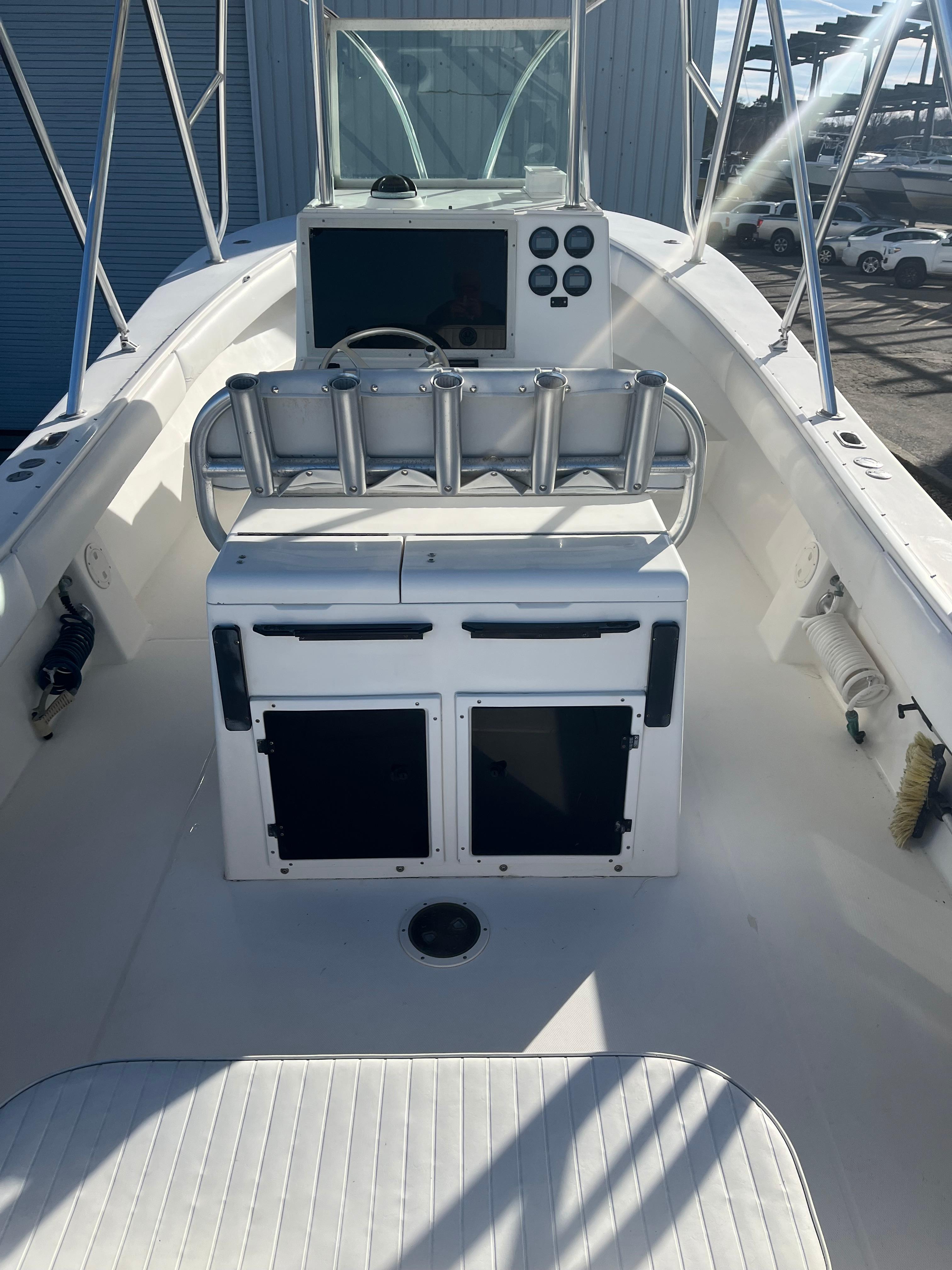 Slide: The Image of 2000 Regulator 32 Center Console boat interior with helm and seating area. - 7