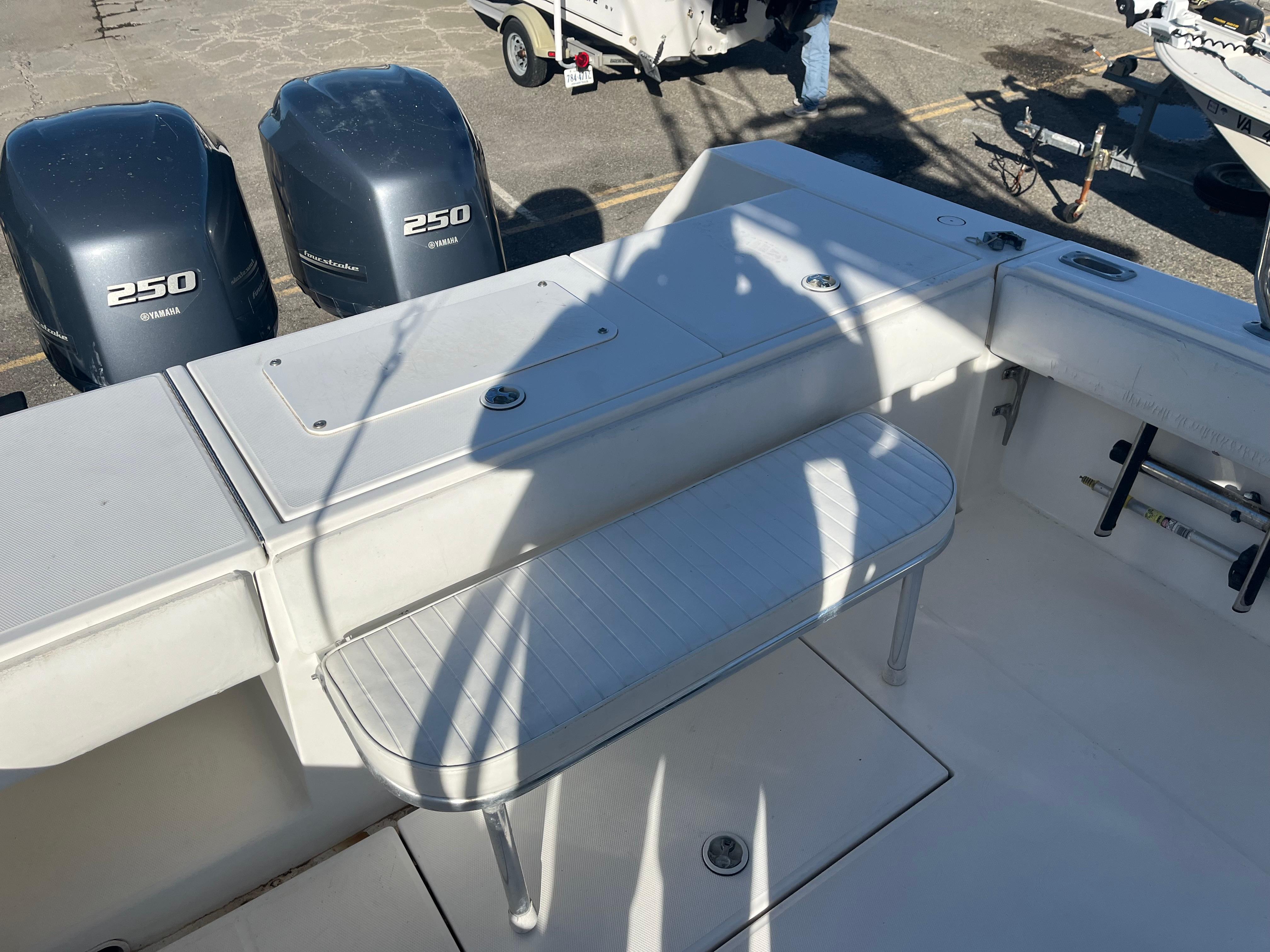 Slide: The Image of 2000 Regulator 32 Center Console boat with Yamaha 250 engines, docked and ready. - 8