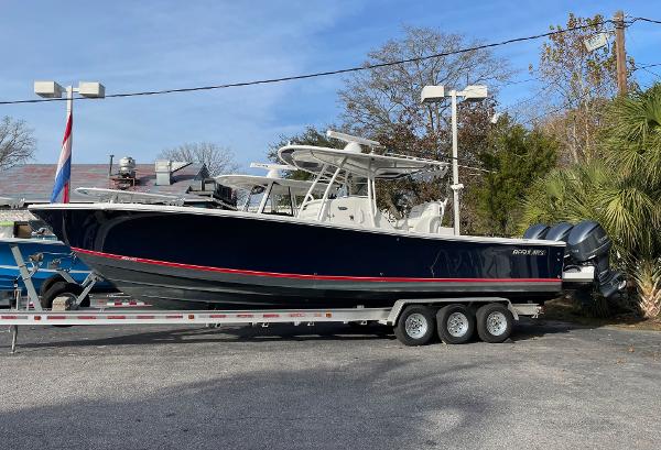 Slide: The Image of 2016 Regulator 34SS boat on a trailer, parked outdoors. - 12