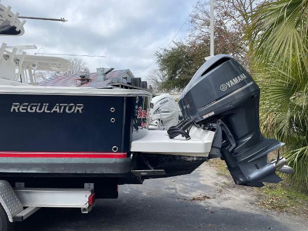 Slide: The Image of 2016 Regulator 34SS boat with Yamaha outboard motor, parked on a trailer. - 16