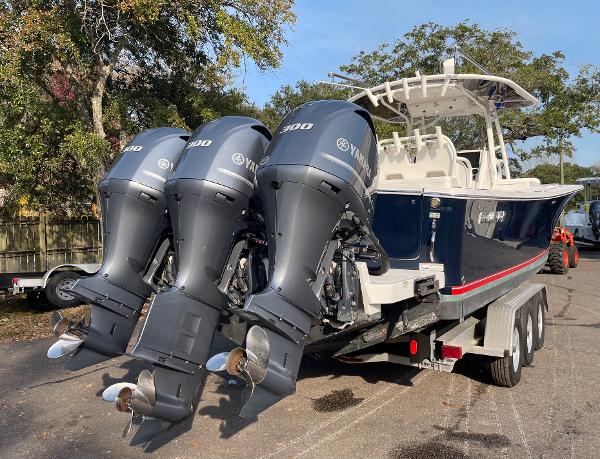 Slide: The Image of 2016 Regulator 34SS boat with triple Yamaha 300 engines on trailer. - 17